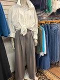 grey pleated trousers