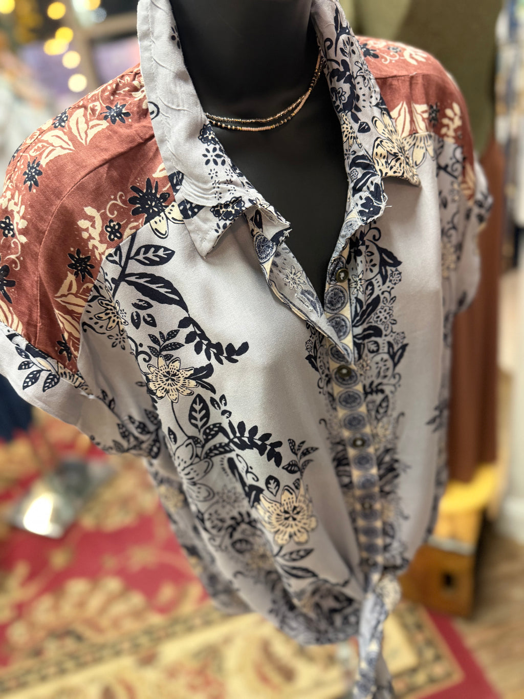Blue/Lavender print with brown detailing button up collared front tie blouse