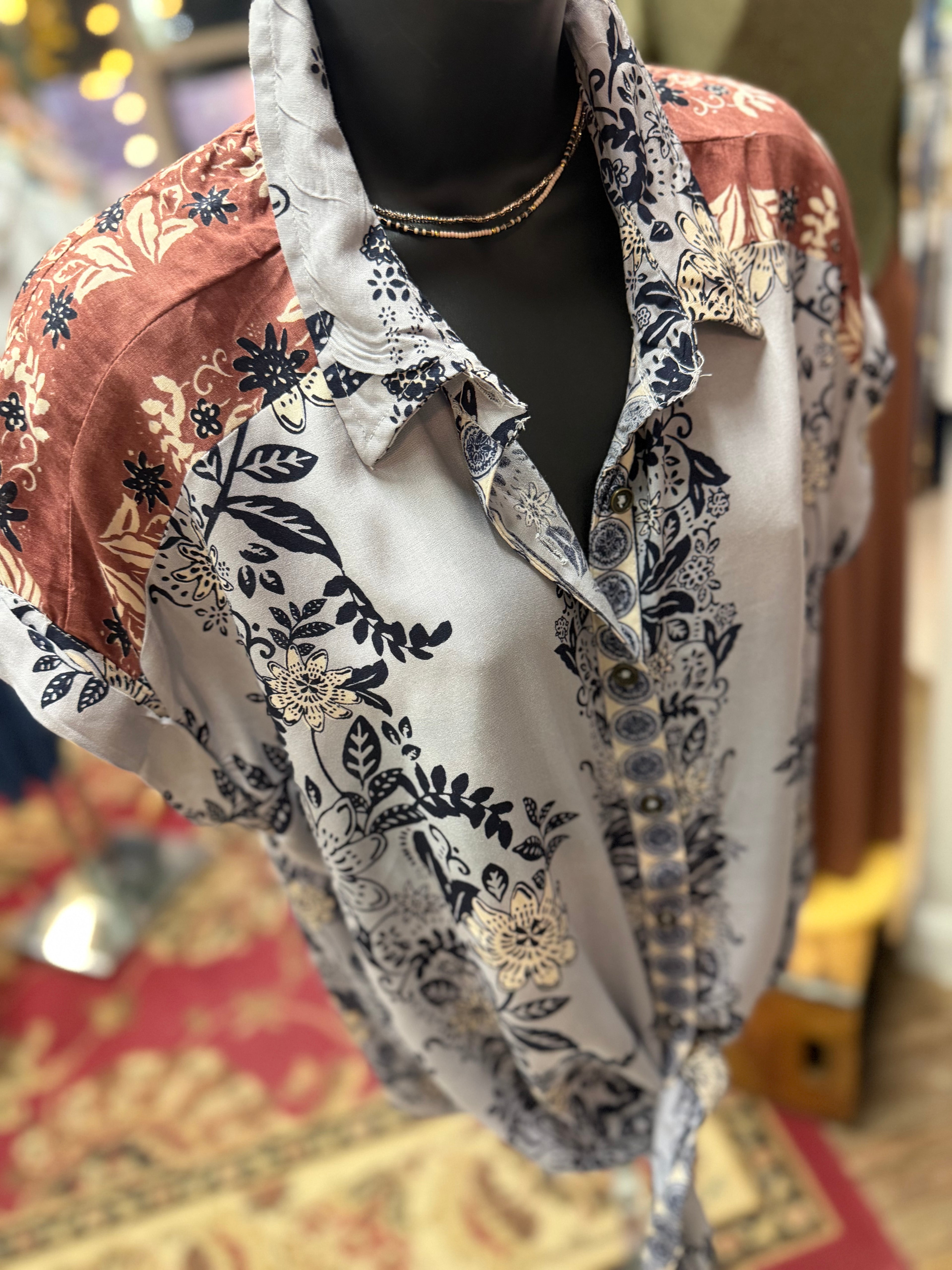 Blue/Lavender print with brown detailing button up collared front tie blouse