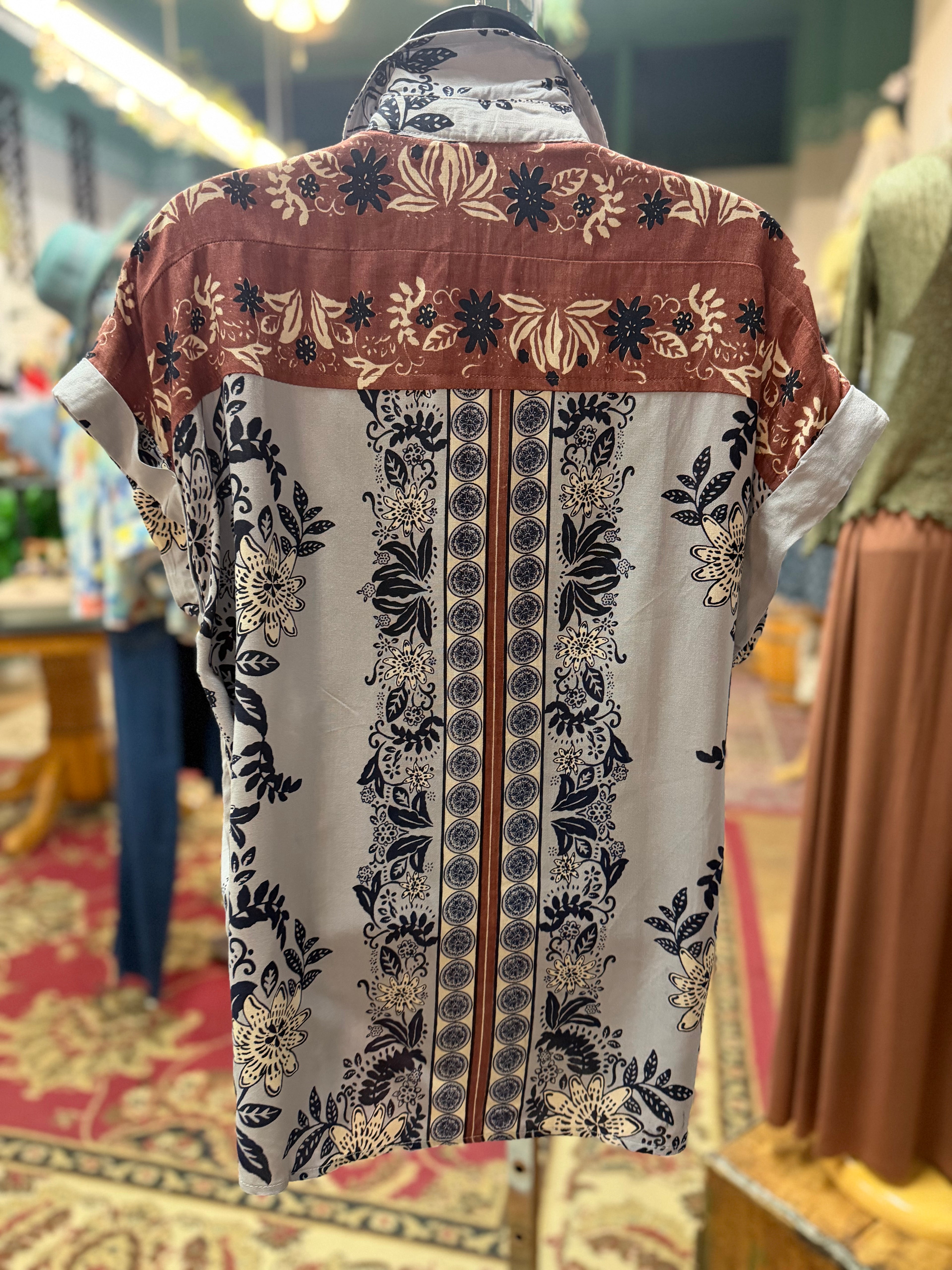 Blue/Lavender print with brown detailing button up collared front tie blouse