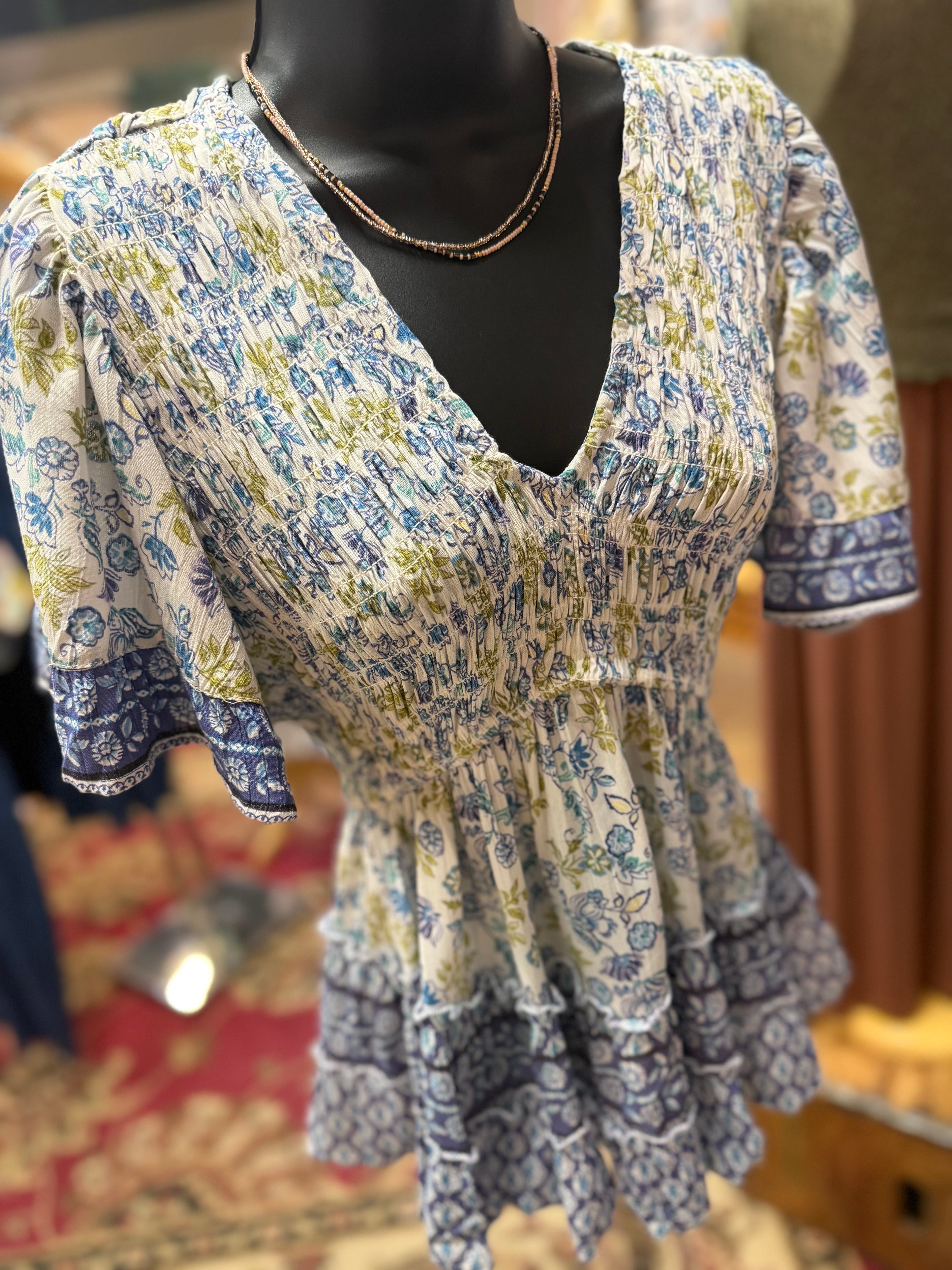 Blue print smocked bodice flutter short sleeve top