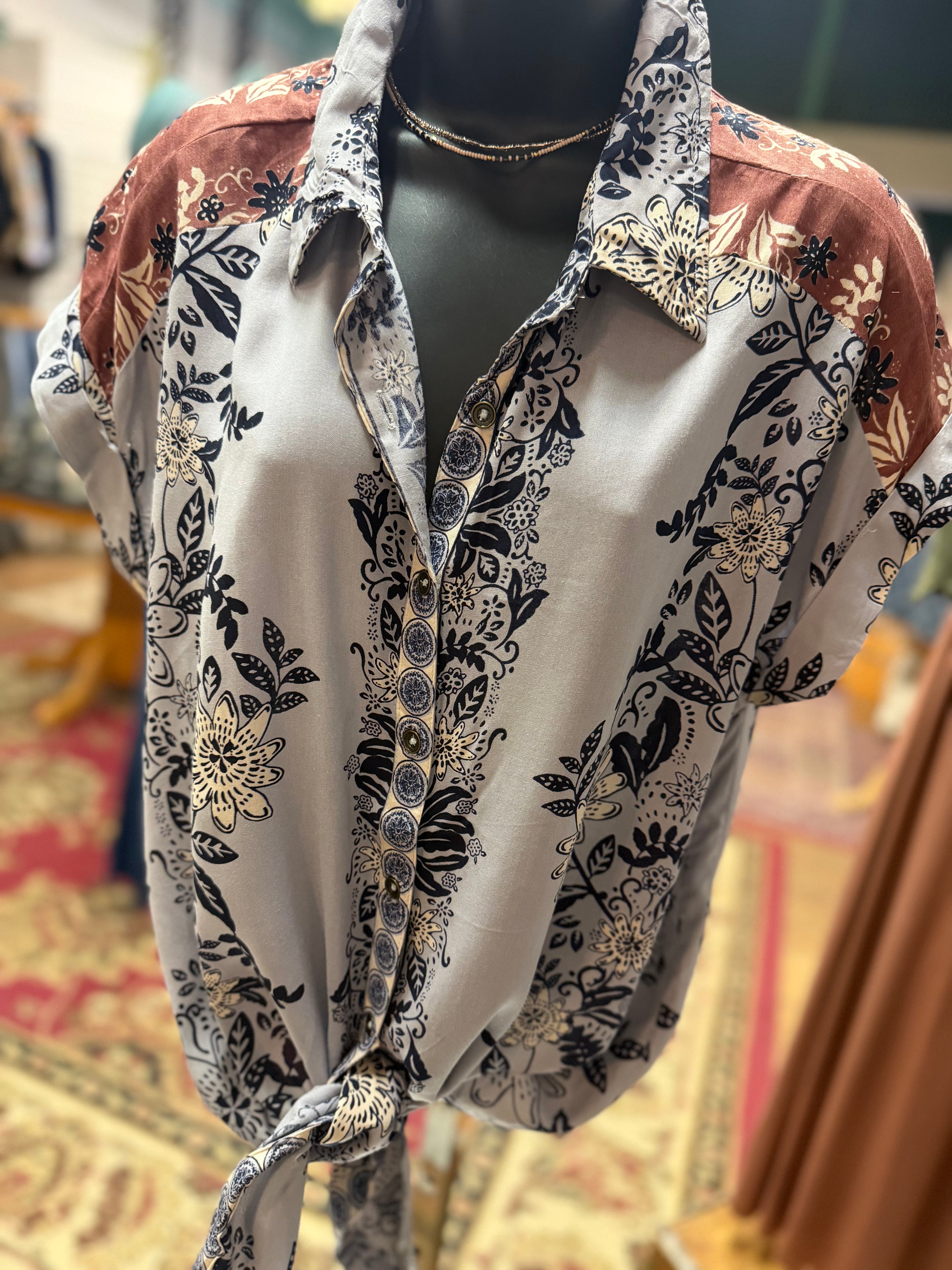 Blue/Lavender print with brown detailing button up collared front tie blouse