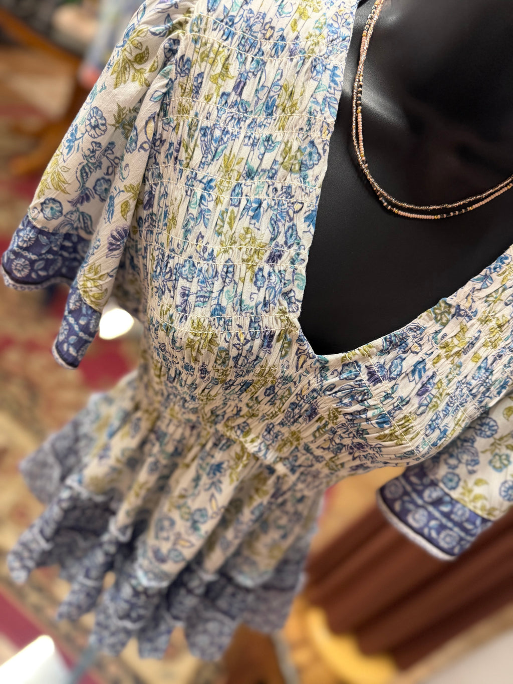 Blue print smocked bodice flutter short sleeve top