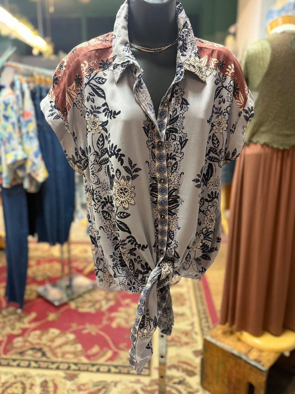 Blue/Lavender print with brown detailing button up collared front tie blouse